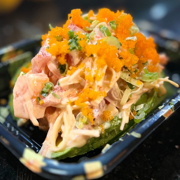 Ninja Sushi & Hibachi's spicy tuna salad with green onions and bright orange tobiko.